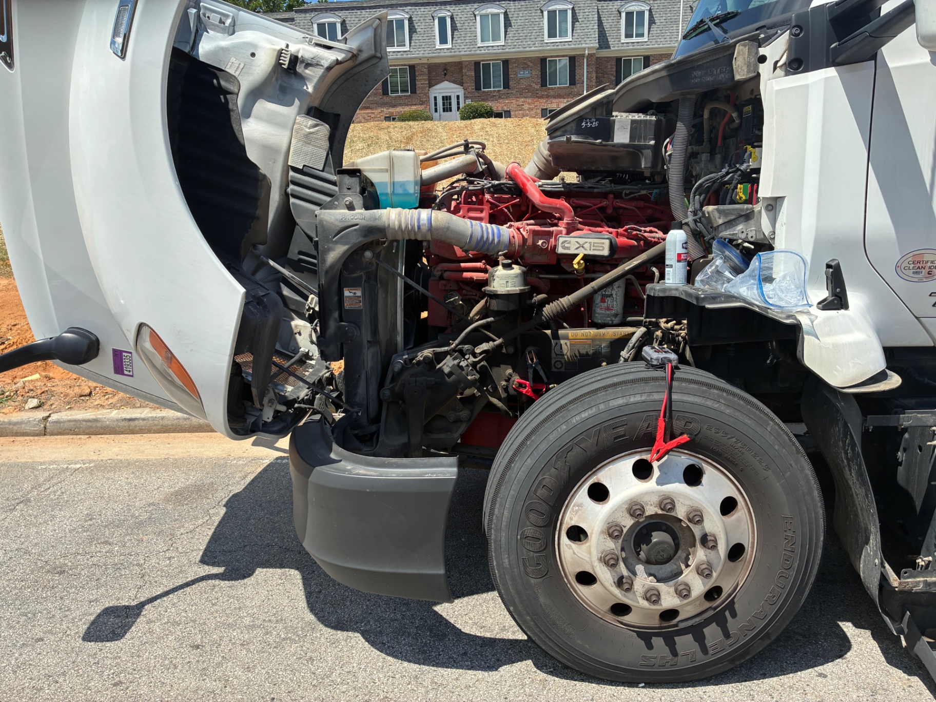 Semi-truck roadside assistance with open hood